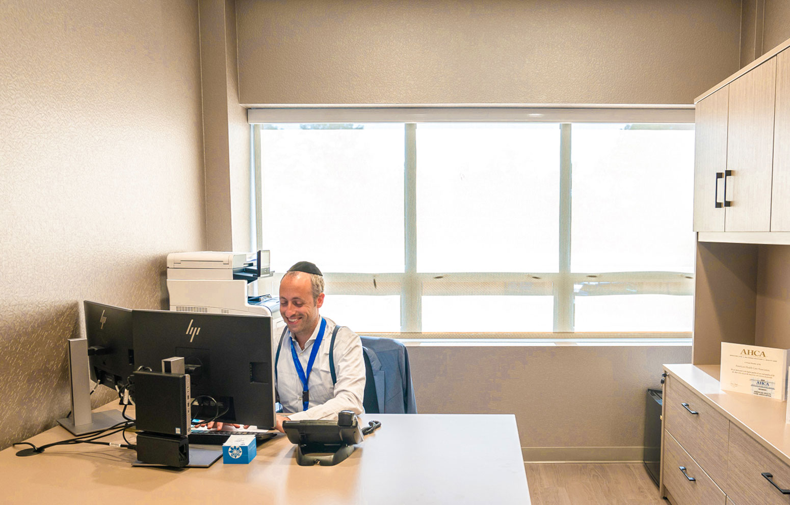 staff member working at his computer